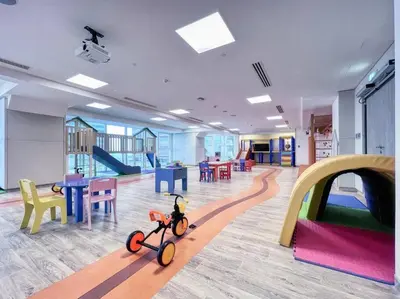 a room with a toy bike in the middle of a room at Studio apartment MeDoRe Tower in Dubai