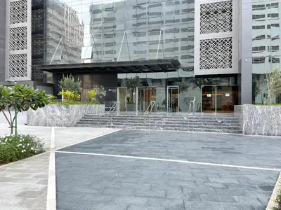 a large building with stairs in front of it at Blueground Sheikh Zayed Rd pool gym DXB-462 in Dubai