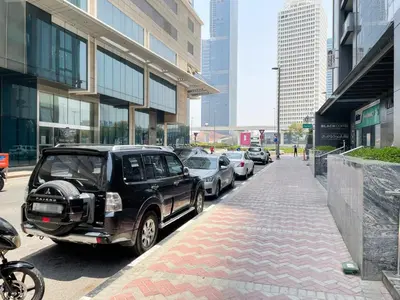 a car parked on the side of a city street at Blueground Sheikh Zayed Rd pool gym DXB-462 in Dubai