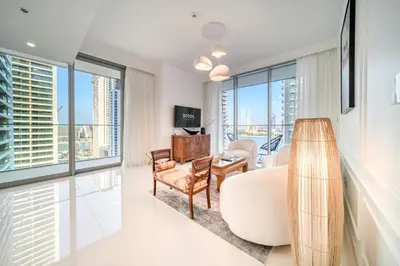 a living room with a view of a city at Chic 2BR with Iconic Dubai Eye and Palm Views in Dubai
