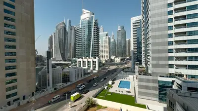 a view of a city with tall buildings at Dubai Marina - 1 BHK Classy Apartment in Dubai