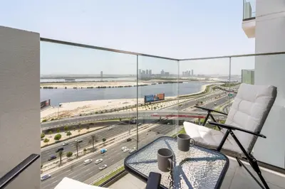a room with a balcony with a view of a highway at GuestReady - Luxurious paradise in Dubai in Dubai