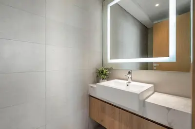 a bathroom with a sink and a mirror at GuestReady - Luxurious paradise in Dubai in Dubai