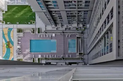a large building with a large screen in the middle at Creek Vistas Reserve - Modern One Bedroom in Dubai