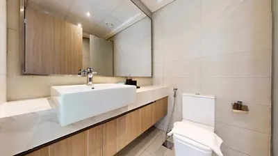 a bathroom with a sink and a toilet at Azizi Riviera 18 - Neat One Bedroom in Meydan in Dubai