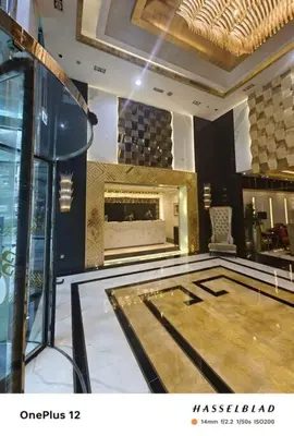 a large room with a fireplace in a building at Luxurious Apartment 500 Meters Next to Dubai Mall in Dubai