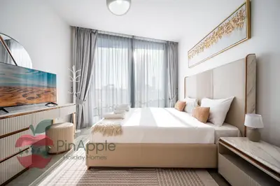 a bedroom with a large bed and a large window at Lux 1BR Direct access to Dubai Marina 4 people in Dubai