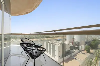a black chair sitting on top of a building at Silkhaus Modern Studio in Reef Residence at JVC in Dubai