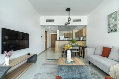 a living room with a couch and a table at ShoresInn - Artistic Retreat in Dubai Marina in Dubai