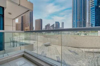 an apartment balcony with a view of the city at ShoresInn - Artistic Retreat in Dubai Marina in Dubai