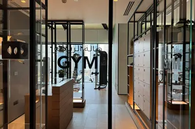a store with glass doors and a sign that readsxual city at Vida Dubai Marina Residences in Dubai