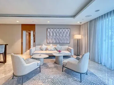 a living room with a couch and chairs at Luxurious 2BDR Apartment with Burj Khalifa Views in Dubai