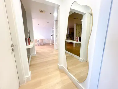 a hallway with a large mirror on a wall at Stunning 2BR In Dubai Marina With Amazing views in Dubai