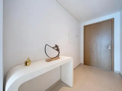 a mirror on a white table in a room at Chic 4 Bedroom Apartment I Burj Khalifa & Fountain Views I Direct Access to Dubai Mall I Free Gym, Pool, Parking Wi-Fi and PS5 I by Skyline Serenity in Dubai