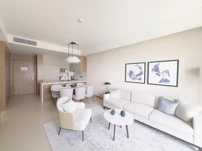 a living room with a couch and a table at ADDRESS Residences Opera 2BR Tower 1 - EPIC 30th floor Burj Khalifa view byBLCK with DXB AIRPORT VIP Shuttle option in Dubai