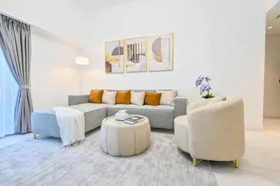 a living room with a couch and two chairs at Iconic Sea View Marina - LUX NEW in Dubai