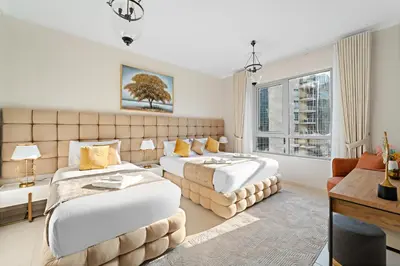a hotel room with two beds and a window at Ace Luxe, 2BR, Downtown, Burj Khalifa & Dubai Fountain view, 5 mins walk to Dubai Mall in Dubai
