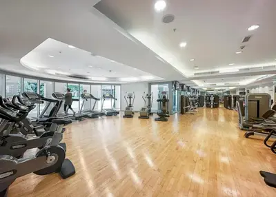 a gym with treadmills and exercise equipment in a building at Ace Luxe, 2BR, Downtown, Burj Khalifa & Dubai Fountain view, 5 mins walk to Dubai Mall in Dubai