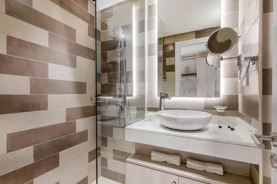 a bathroom with a sink and a mirror at Cozy studio in Seven Palm in Dubai