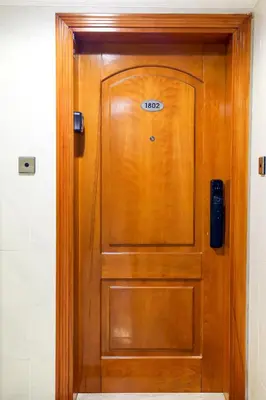 a wooden door with a sign on it at Superb 1Bed Marina View pool JBR Beach Parking in Dubai