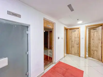 a room with a glass door and a red rug at ShoresInn - Magnificent 1BR in Dubai Marina in Dubai