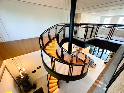 an overhead view of a spiral staircase in a building at Cozy 1 Bedroom in Golfville Dubai Hills in Dubai