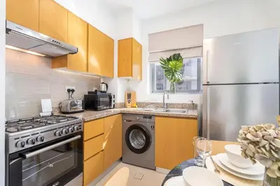a kitchen with a stove and a dishwasher at Mystic - Stylish High-Rise Living with Premium Amenities in Dubai