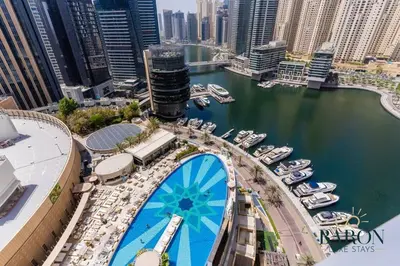 an aerial view of a marina with boats in the water at The Elegant Escape in Dubai