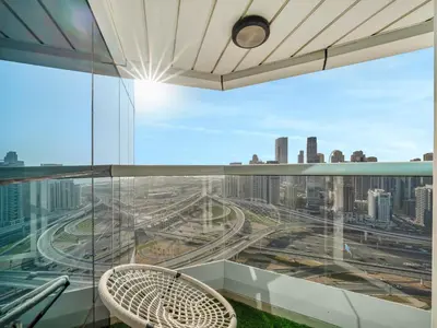 a balcony with a view of a city at Stunning Panoramic Sea & Marina Skyline View in Dubai