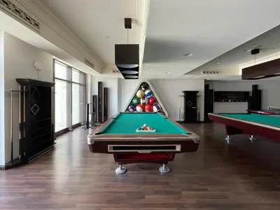 a billiard room with two pool tables in it at GuestReady - Downtown lux near Burj Khalifa in Dubai