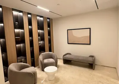 a waiting room with two chairs and a table at Luxurious 2BR I Burj Khalifa View I Downtown Dubai in Dubai