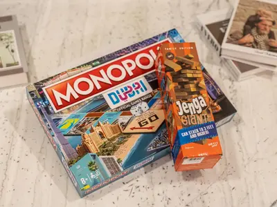 a package of monopoly candy and chips on a counter at Elegant Dubai Eye Beach Retreat in Dubai