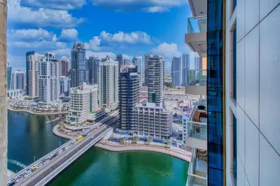 a view of a city with a river and buildings at ShoresInn - Fantastic Marina Waterfront View in Dubai