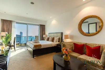 a hotel room with a bed and a couch at The Haven in Dubai