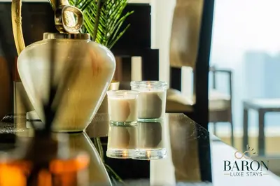 a glass of drink and a bottle on a table at The Haven in Dubai