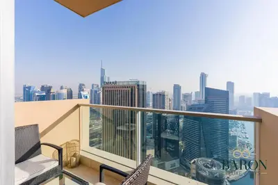 a balcony with chairs and a view of the city at The Haven in Dubai