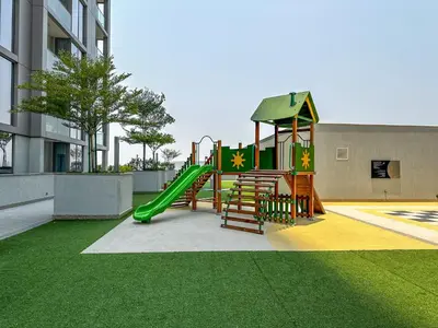 a playground with a slide in a building at Ahlan HH - Luxury 2BR in Sobha Creek Vistas in Dubai
