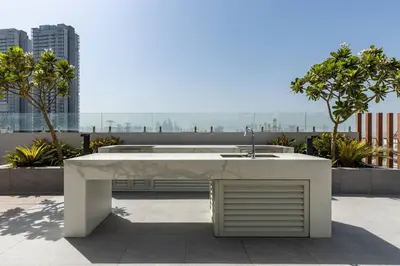 a white table with a sink on a roof at Waves - Elegant Oxford 212 Studio in JVC with City Views in Dubai