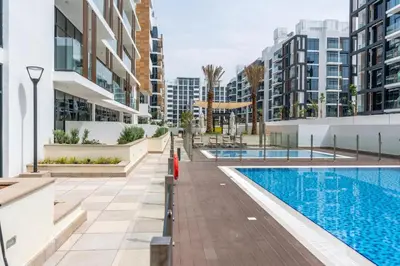 an image of a swimming pool in a building with buildings at Ahlan HH - Stylish Studio with Pool & Gym, Azizi Riviera 26 in Dubai