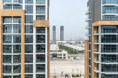 an aerial view of buildings in a city at Ahlan HH - Stylish Studio with Pool & Gym, Azizi Riviera 26 in Dubai