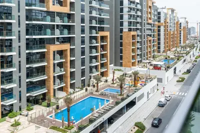 an aerial view of an apartment complex with a swimming pool at Ahlan HH - Stylish Studio with Pool & Gym, Azizi Riviera 26 in Dubai