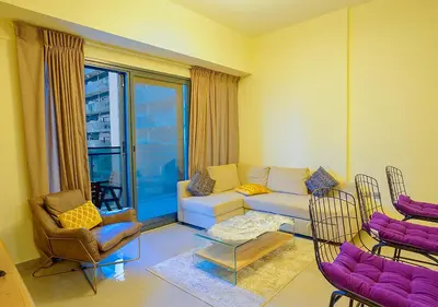 a living room with a couch and chairs at NiceVisit Merano 1BD Business Bay in Dubai