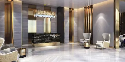 a lobby with chairs and a chandelier at NiceVisit Majestine Stuido Business bay in Dubai