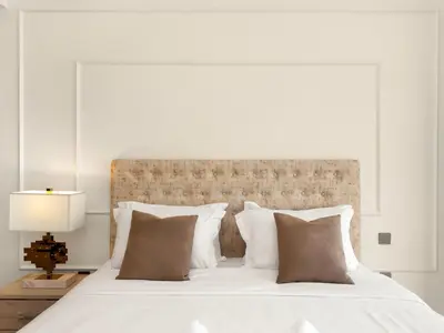 a bedroom with a white bed with a large headboard at Burj Khalifa View Luxe 2BR, 5 Mins walk to Dubai Mall in Dubai