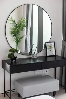 a black desk with a mirror and a plant at Famous Address JBR HIGH FLOOR Sea View in Dubai