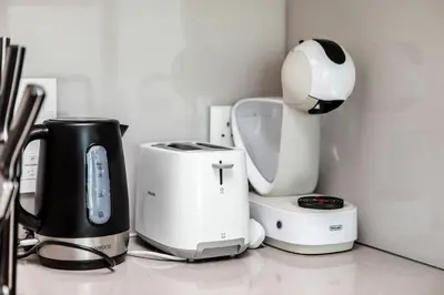 a kitchen counter with a coffee maker and a blender at Famous Address JBR HIGH FLOOR Sea View in Dubai
