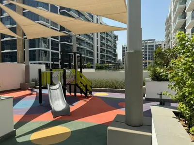 a patio with a playground in a building at Stunning Studio in Meydan Azizi 42 in Dubai