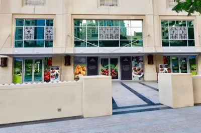 a facade of a building with doors and windows at Downtown Gem, Fountain View! in Dubai