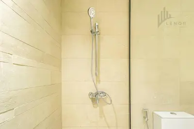 a shower in a bathroom with a toilet at Chic 2BR with Partial Burj Khalifa View in Dubai