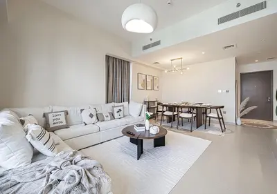 a living room with a couch and a table at Luxury Apartment with Full Burj Khalifa and Downtown Views in Dubai